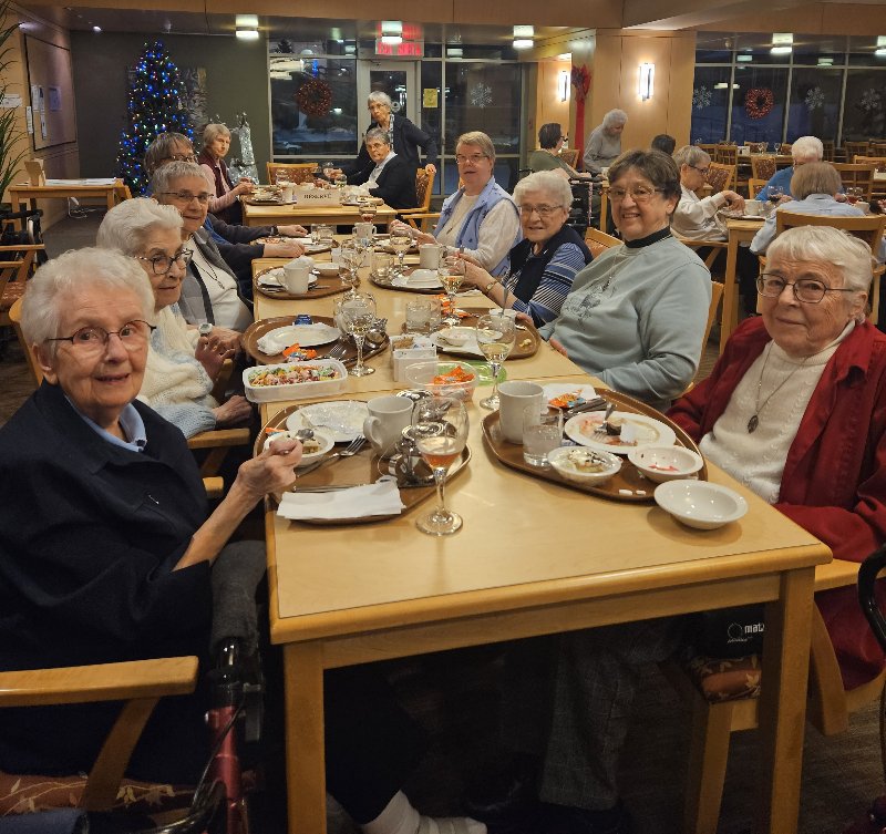 Sisters sharing meal at Immaculate Conception Feast